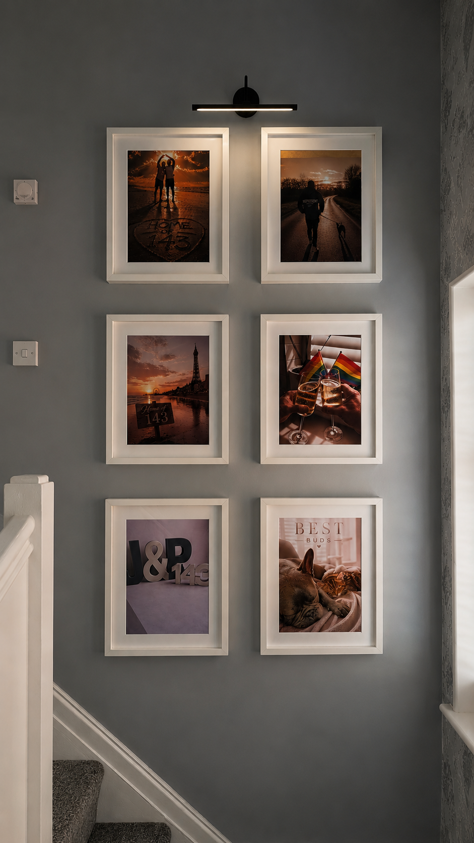Gallery wall of personal prints created by Visualo Studio, displayed in the founder's home.